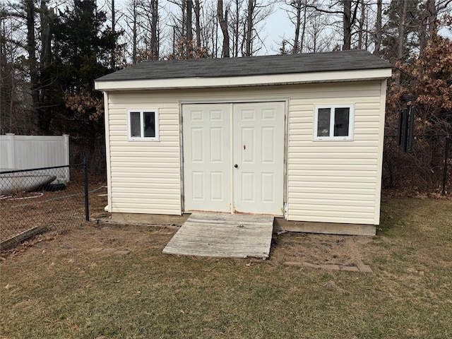 view of shed with fence