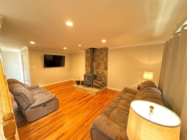 living room with ornamental molding, recessed lighting, and wood finished floors