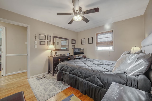 bedroom featuring ceiling fan and light hardwood / wood-style floors