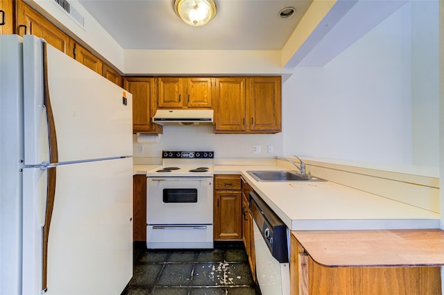 kitchen featuring sink, white appliances, and kitchen peninsula