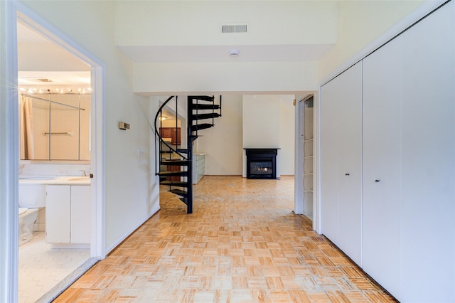 corridor with sink and light parquet floors