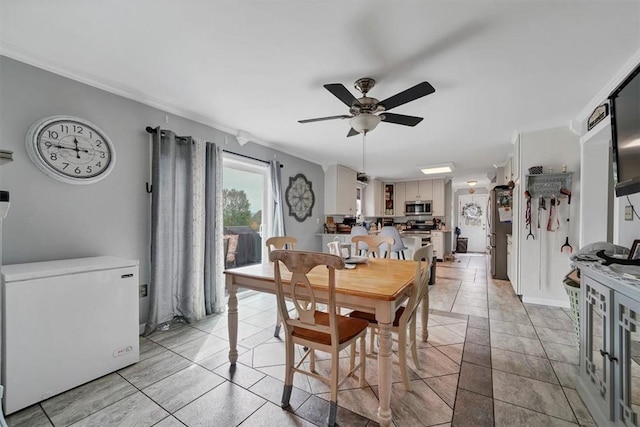 dining area featuring ceiling fan and light tile patterned flooring