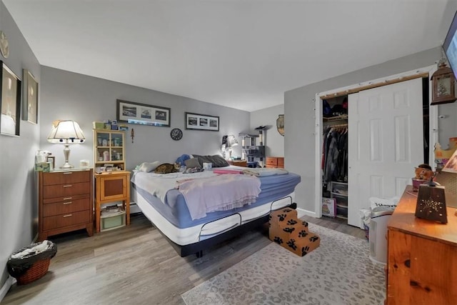 bedroom featuring hardwood / wood-style flooring and a closet