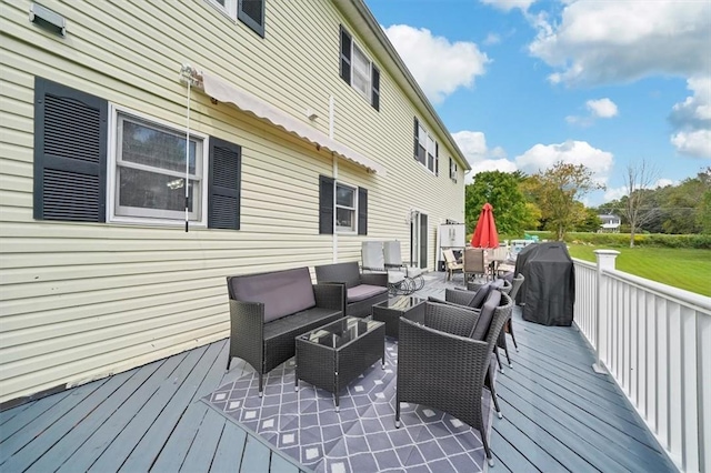 wooden deck featuring outdoor lounge area and grilling area