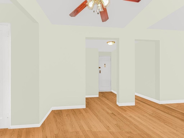 empty room featuring ceiling fan and light hardwood / wood-style floors