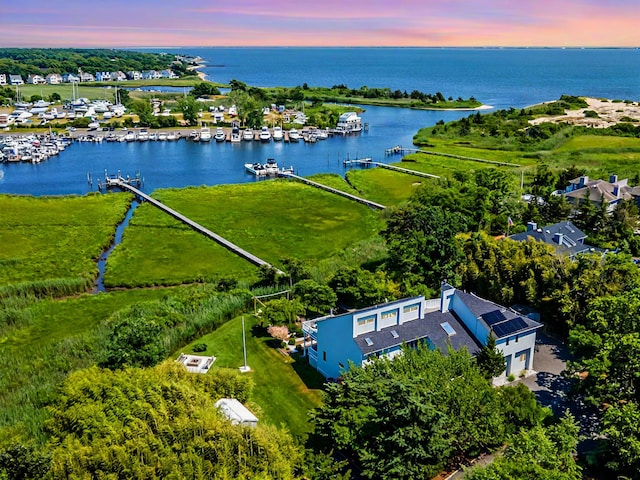 aerial view at dusk with a water view