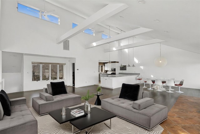 living room with beam ceiling and high vaulted ceiling