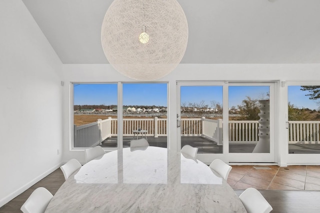 sunroom with a wealth of natural light and vaulted ceiling