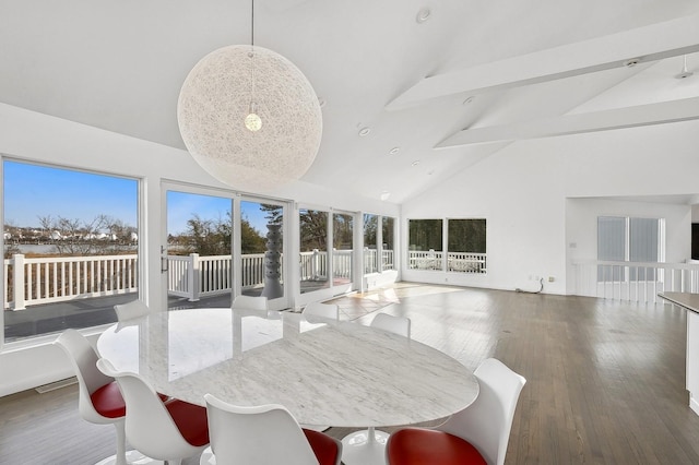 sunroom / solarium with lofted ceiling with beams