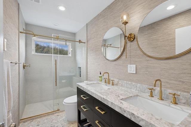 bathroom featuring tile walls, an enclosed shower, vanity, and toilet