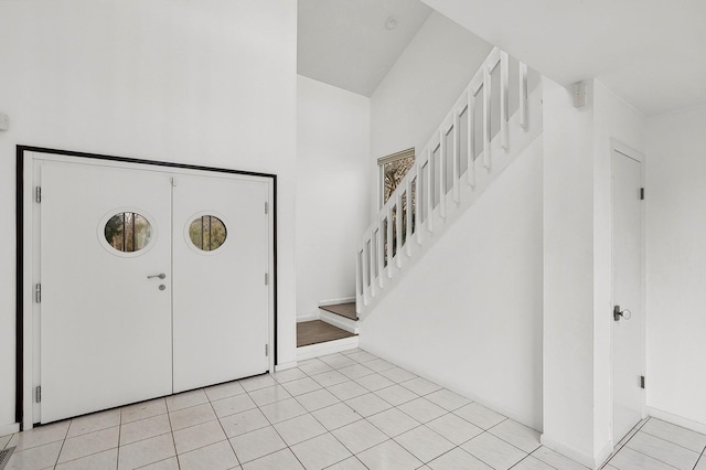 foyer featuring light tile patterned floors