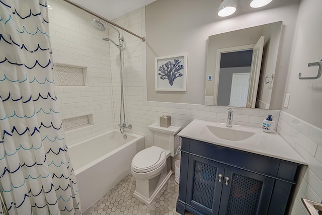 full bathroom featuring tile walls, vanity, toilet, shower / bathtub combination with curtain, and tile patterned floors