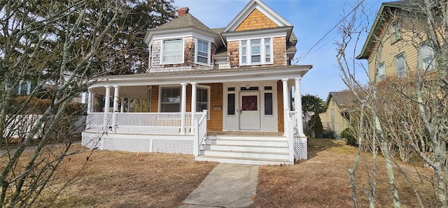 victorian house featuring covered porch