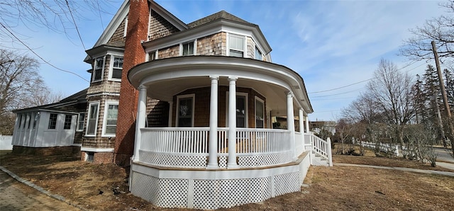 view of property exterior featuring covered porch