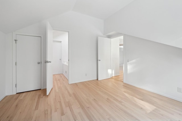 bonus room featuring light hardwood / wood-style floors and lofted ceiling