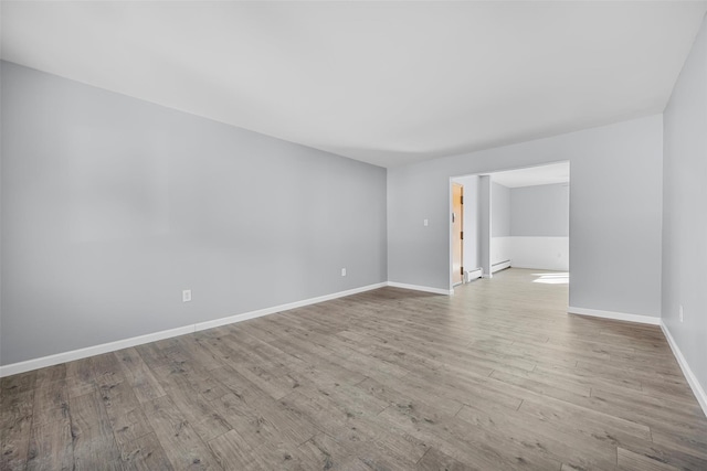 unfurnished room featuring light hardwood / wood-style floors