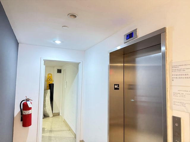 hallway featuring elevator