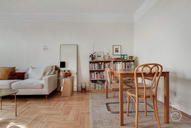 dining space featuring light parquet floors