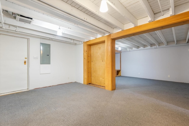 finished basement with electric panel and carpet flooring