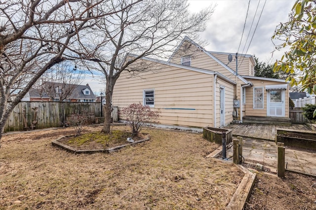 view of property exterior with fence