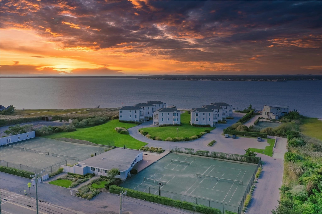 aerial view at dusk with a water view