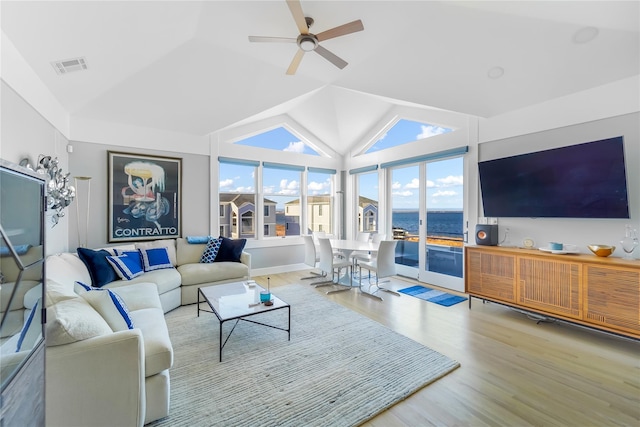 living room with high vaulted ceiling, light hardwood / wood-style floors, and ceiling fan