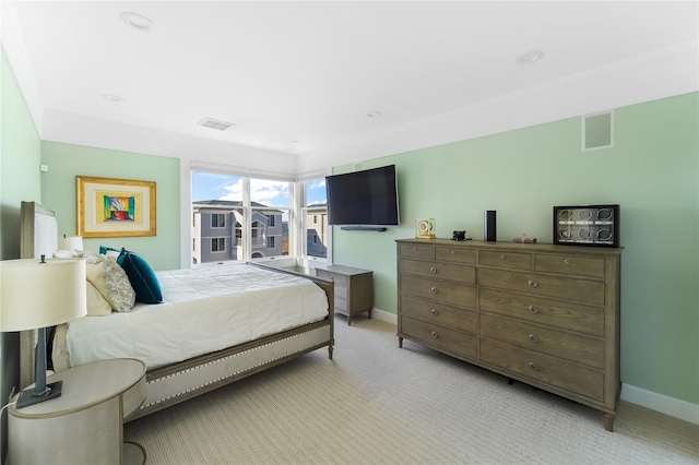 bedroom with light colored carpet