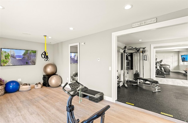 exercise room featuring hardwood / wood-style floors