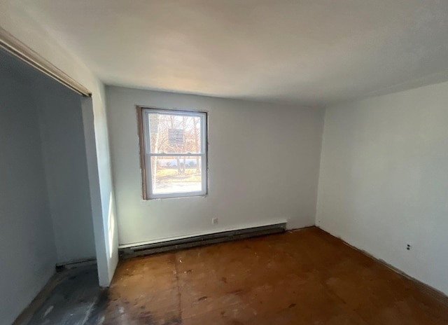 empty room featuring a baseboard radiator