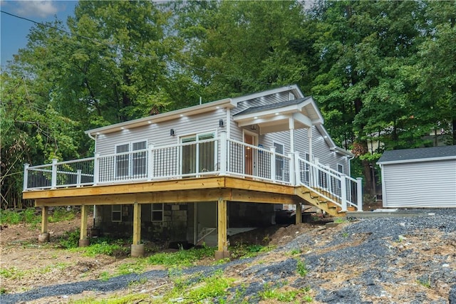 rear view of property with a wooden deck