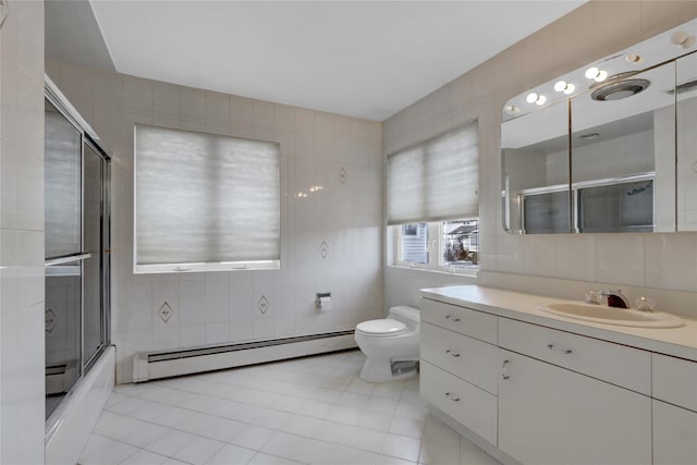 full bathroom featuring tile walls and a baseboard radiator