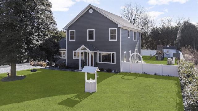 front facade with a playground and a front lawn