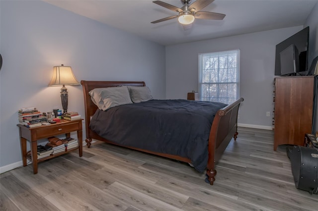 bedroom featuring ceiling fan and light wood-type flooring