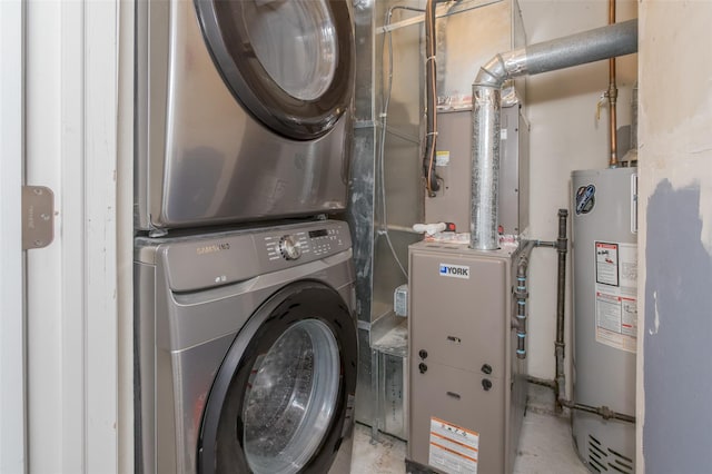 clothes washing area with stacked washer / dryer and gas water heater