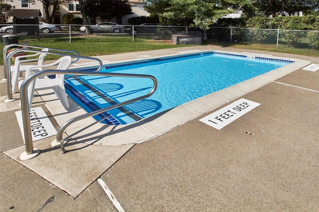 view of swimming pool featuring a patio area