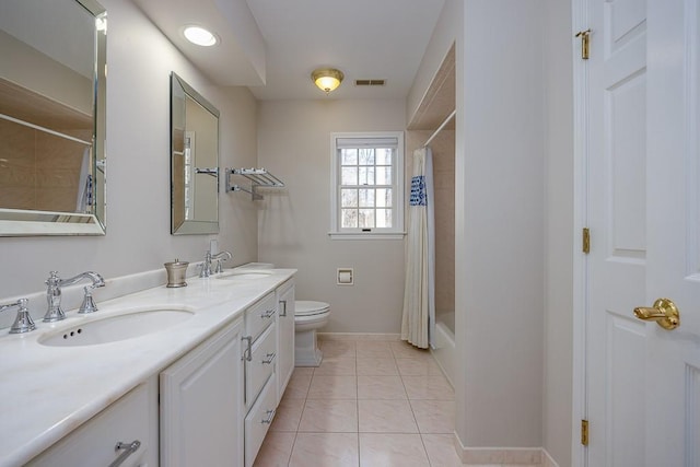 full bathroom featuring tile patterned floors, toilet, vanity, and shower / bath combo