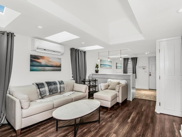 living room featuring dark wood-style floors, a wall unit AC, and a skylight
