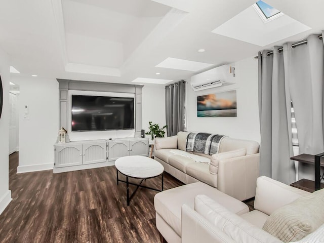 living room with wood finished floors, a skylight, a wall mounted air conditioner, baseboards, and recessed lighting