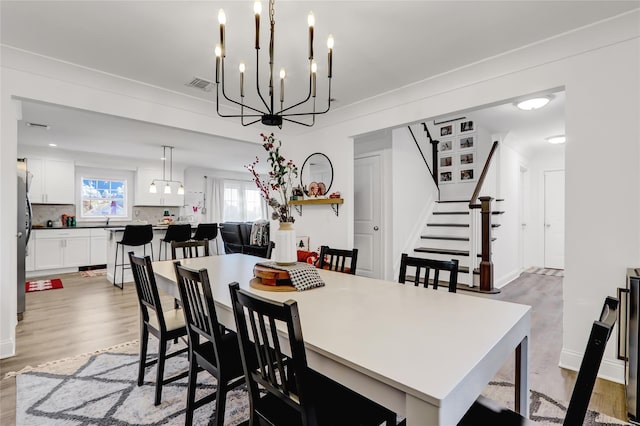 dining space featuring light wood-type flooring