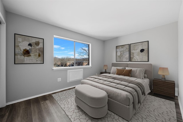 bedroom with hardwood / wood-style flooring