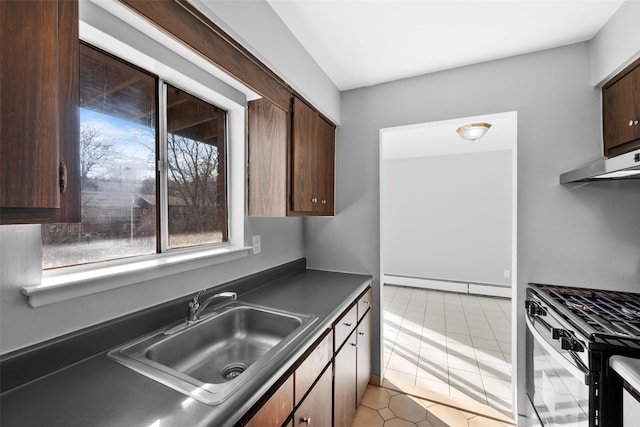 kitchen featuring dark brown cabinetry, a baseboard radiator, sink, and range with gas cooktop