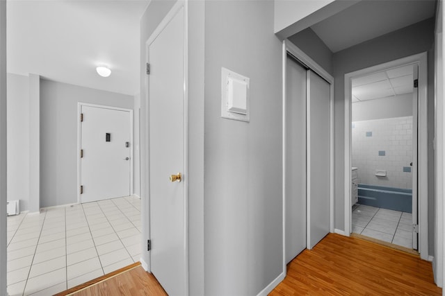 hall featuring tile patterned flooring