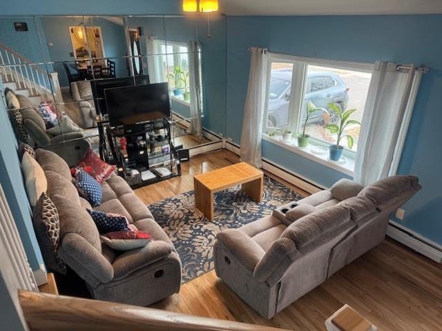 living room with a baseboard radiator and wood-type flooring