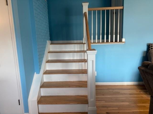 stairway featuring hardwood / wood-style floors