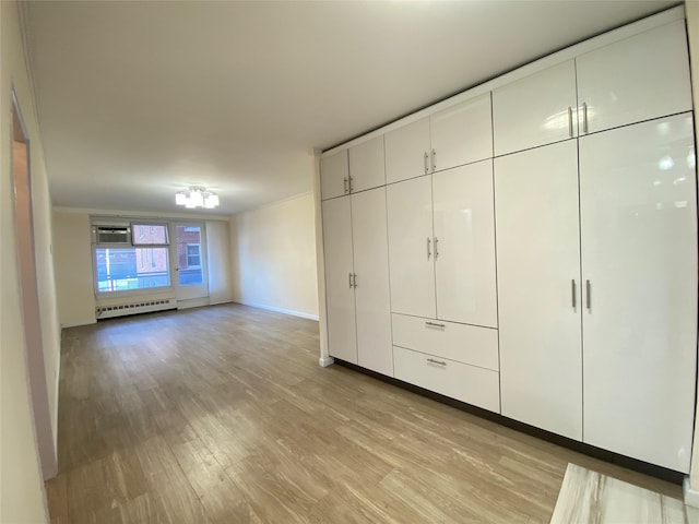 closet featuring baseboard heating