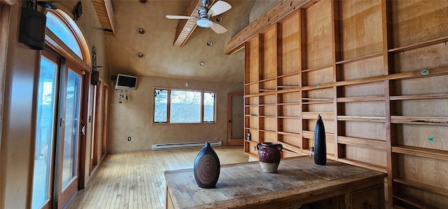 interior space featuring a baseboard radiator, high vaulted ceiling, ceiling fan, and light hardwood / wood-style flooring