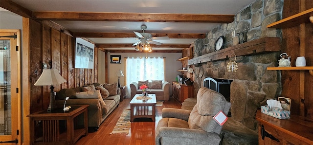 581 Hessinger Lare Rd, Jeffersonville, NY 12748 - living area featuring light wood-style floors, ceiling fan, beam ceiling, and a stone fireplace