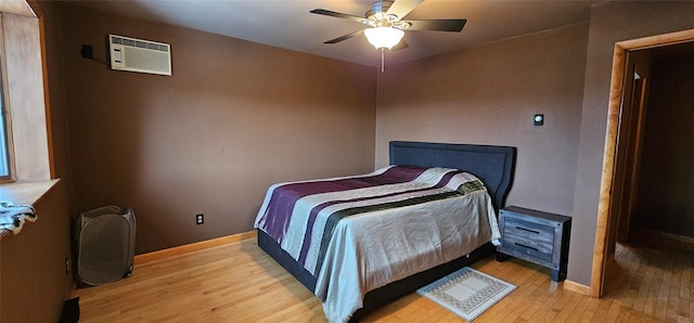 581 Hessinger Lare Rd, Jeffersonville, NY 12748 - bedroom featuring light wood finished floors, a wall mounted air conditioner, and ceiling fan
