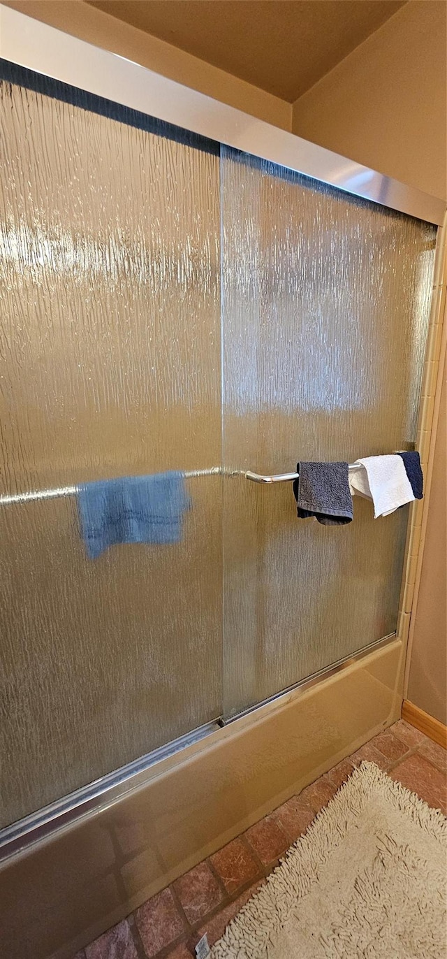581 Hessinger Lare Rd, Jeffersonville, NY 12748 - full bath featuring shower / bath combination with glass door and tile patterned flooring