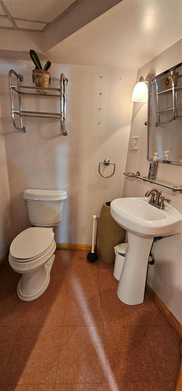 581 Hessinger Lare Rd, Jeffersonville, NY 12748 - half bathroom with toilet and tile patterned floors